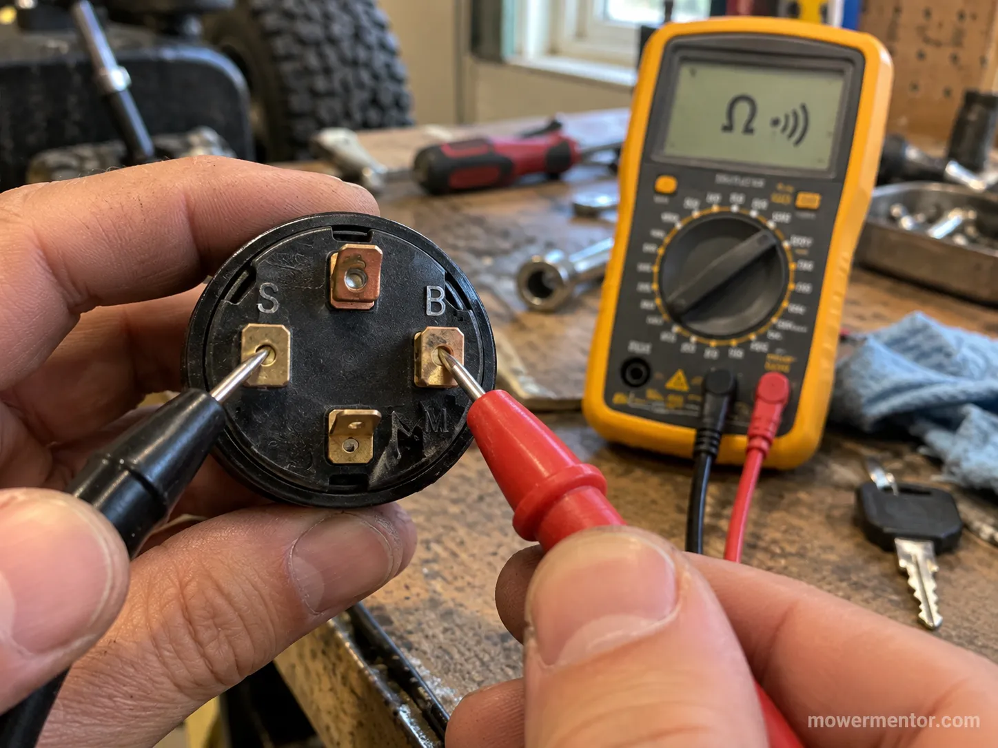 Testing continuity between the S and B terminals of a Craftsman ignition switch.