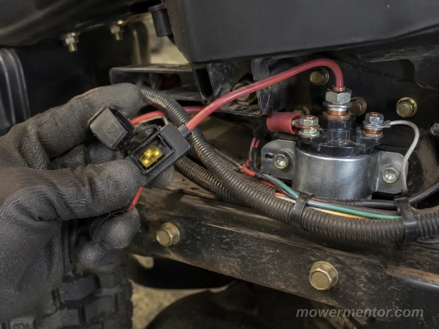Inline blade-fuse holder located in the harness near the starter solenoid on a Craftsman riding mower.