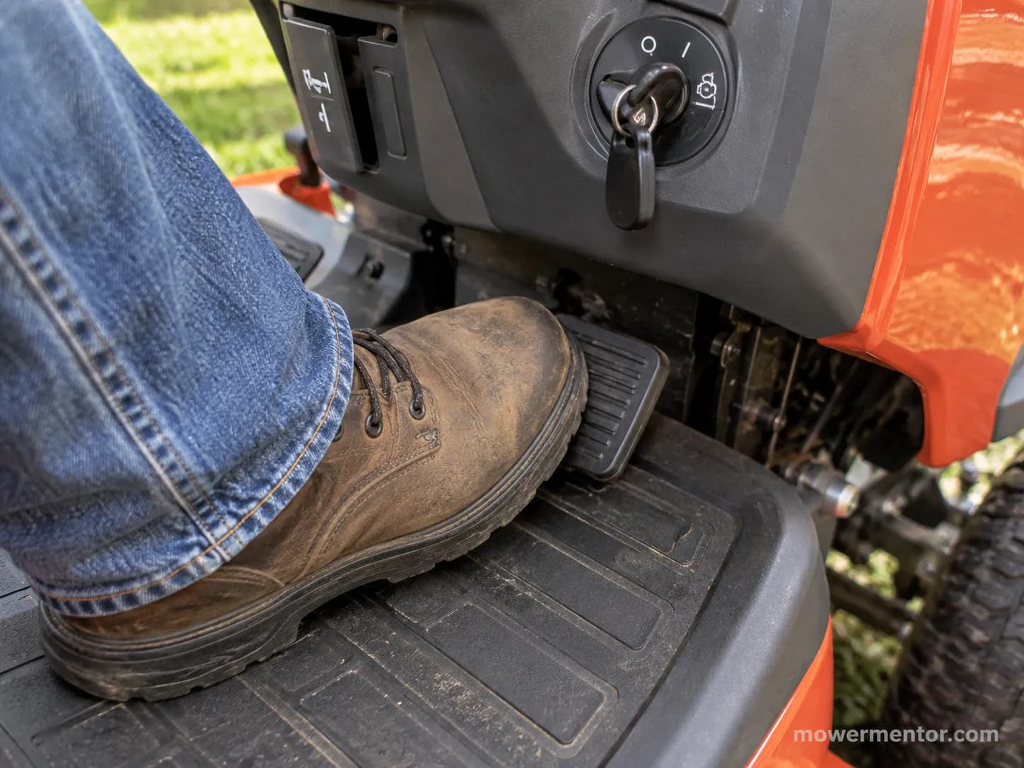 Boot pressing a Husqvarna brake pedal to the floor to reset a no-start