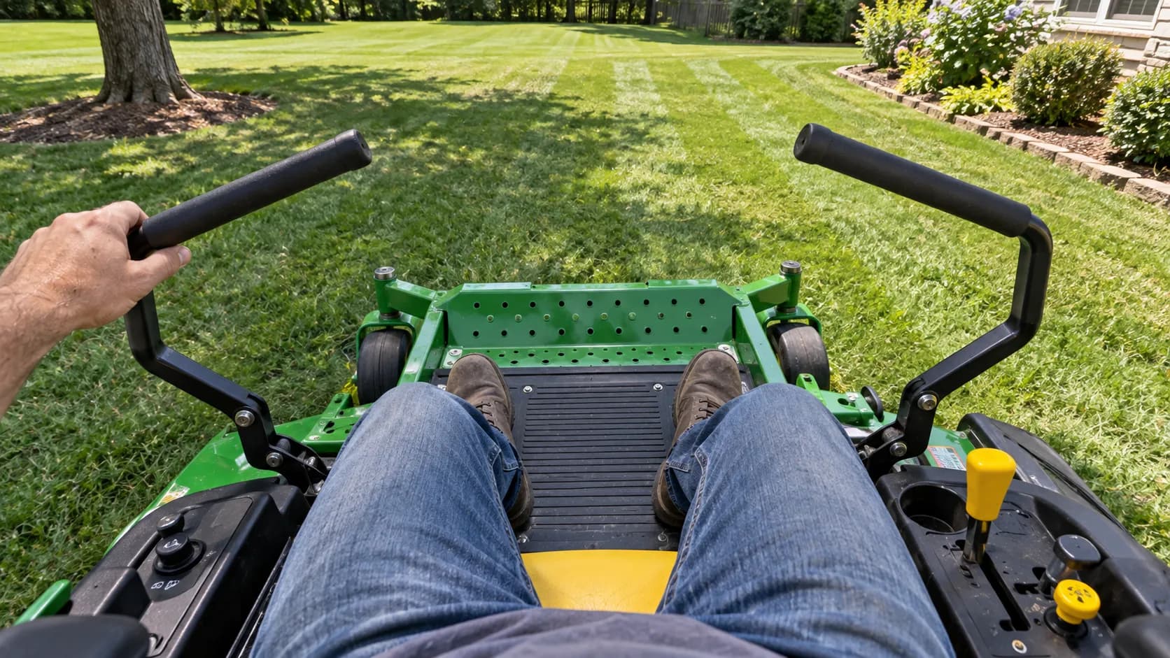 Zero-turn lap bars in the neutral start position on a John Deere mower