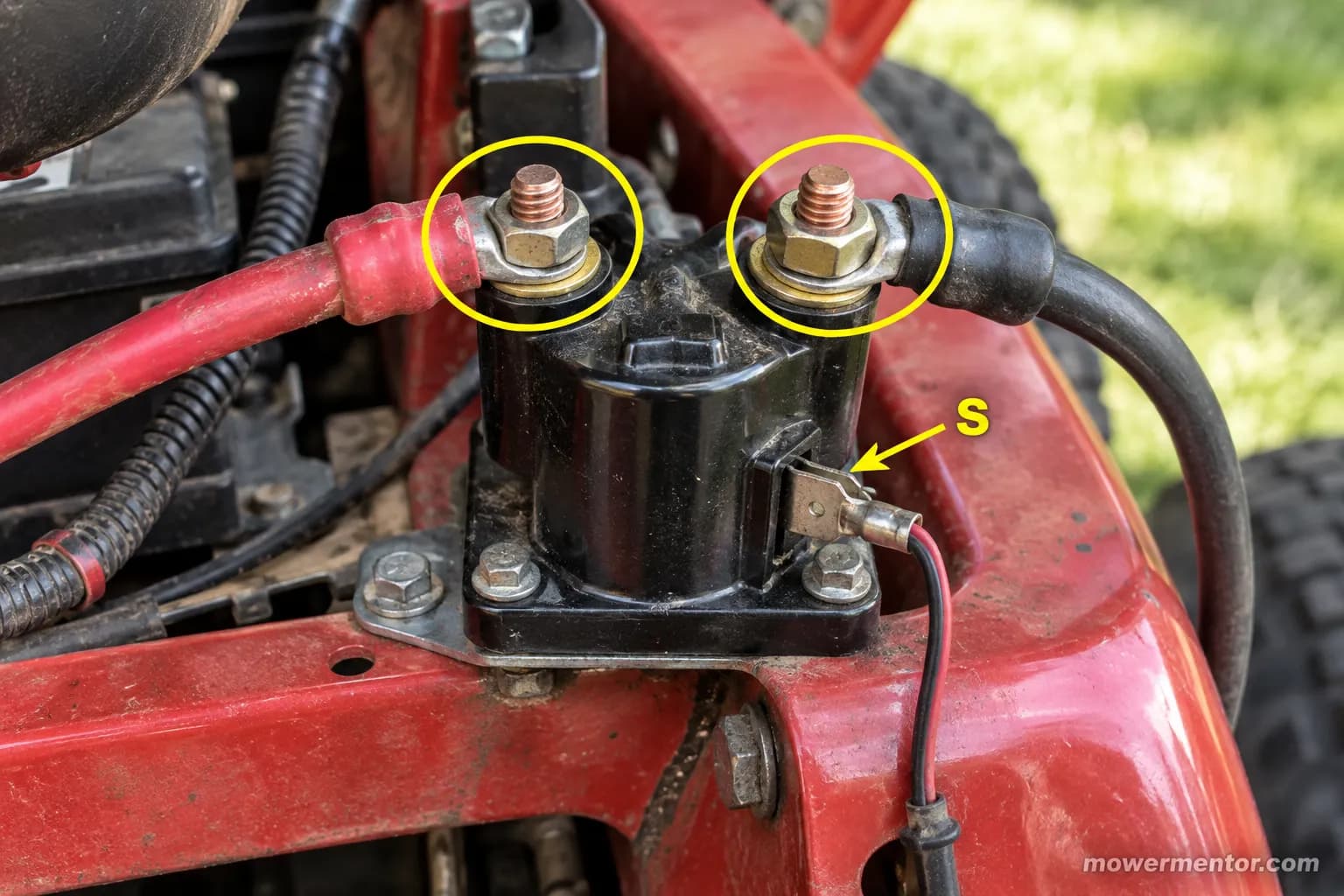 Lawn mower starter solenoid with the two large terminals to bridge circled and the small S terminal labeled