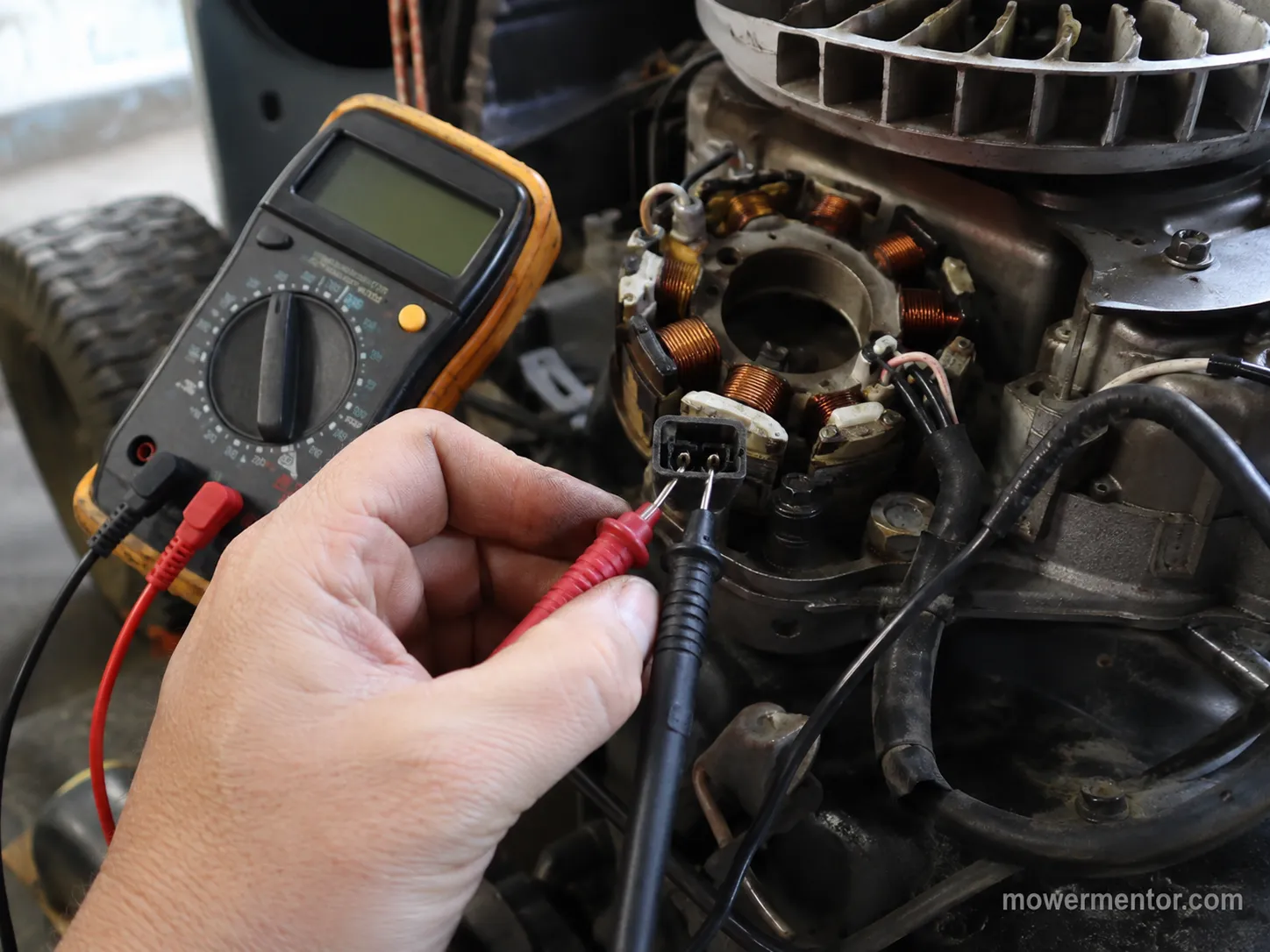 Testing a riding mower stator AC output with a multimeter set to AC volts