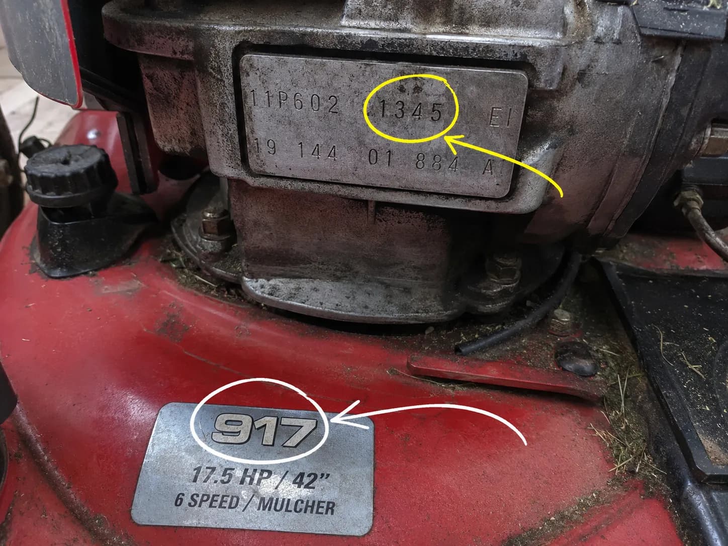 Close-up of a Craftsman mower engine identification stamp and deck model tag with annotation arrows indicating which number is used to identify the correct spark plug.