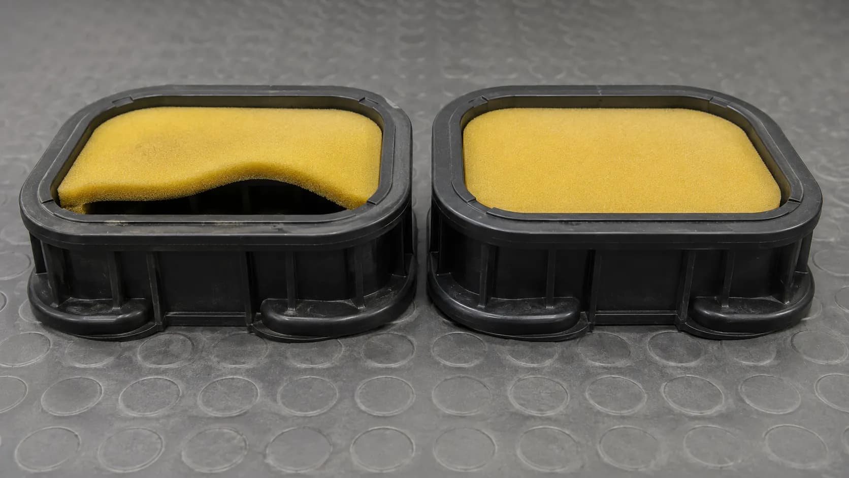 Side-by-side comparison of a warped foam air filter after dishwasher cleaning and an untouched filter seated in identical housings, showing the sealing gap caused by heat distortion.
