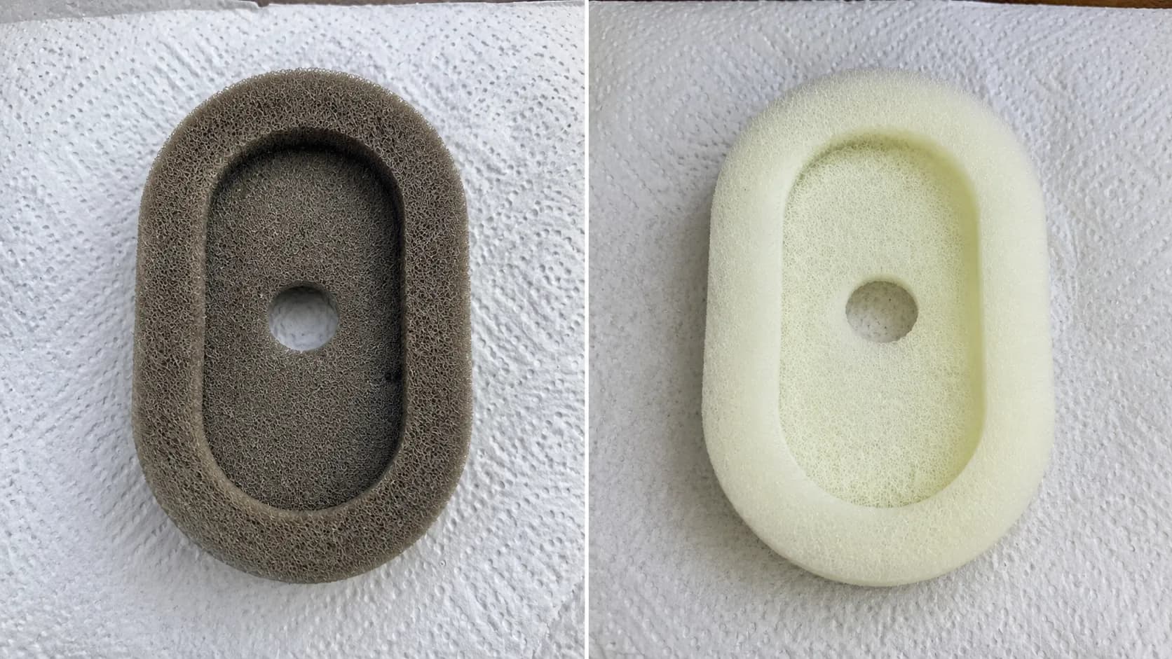 Foam pre-cleaner shown before and after washing, with the dirty grey filter on the left and the clean pale filter on the right, placed side by side on a paper towel.