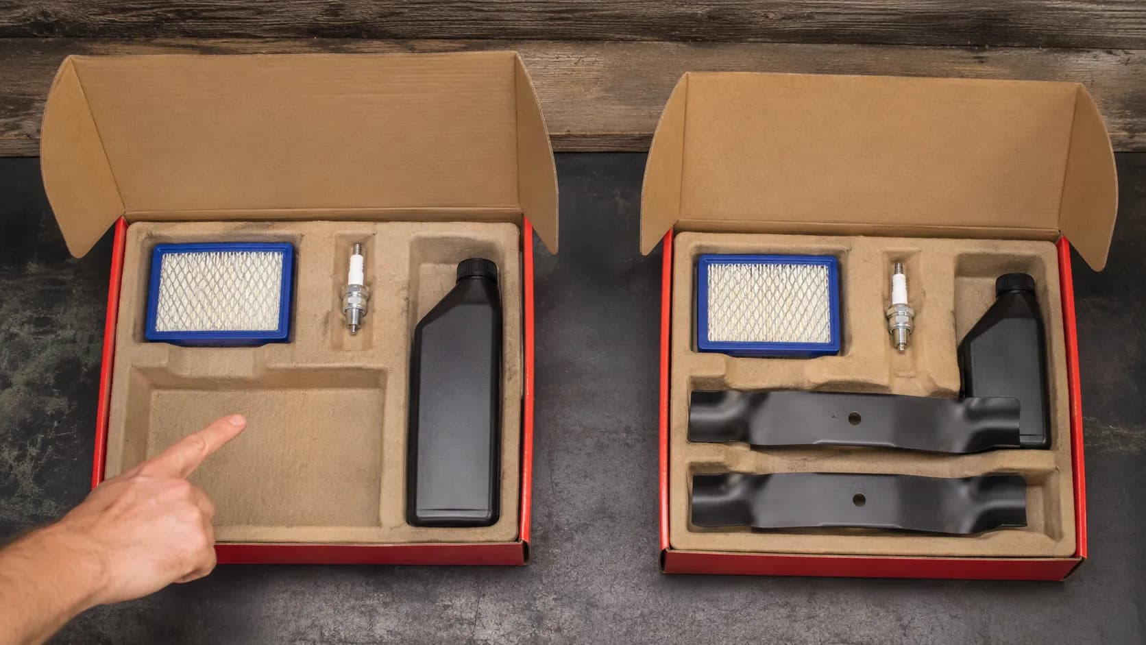 Side-by-side mower maintenance kits with a GC/GCV kit missing blades and an HRX series kit including two mower blades, with a hand pointing to the empty blade compartment.