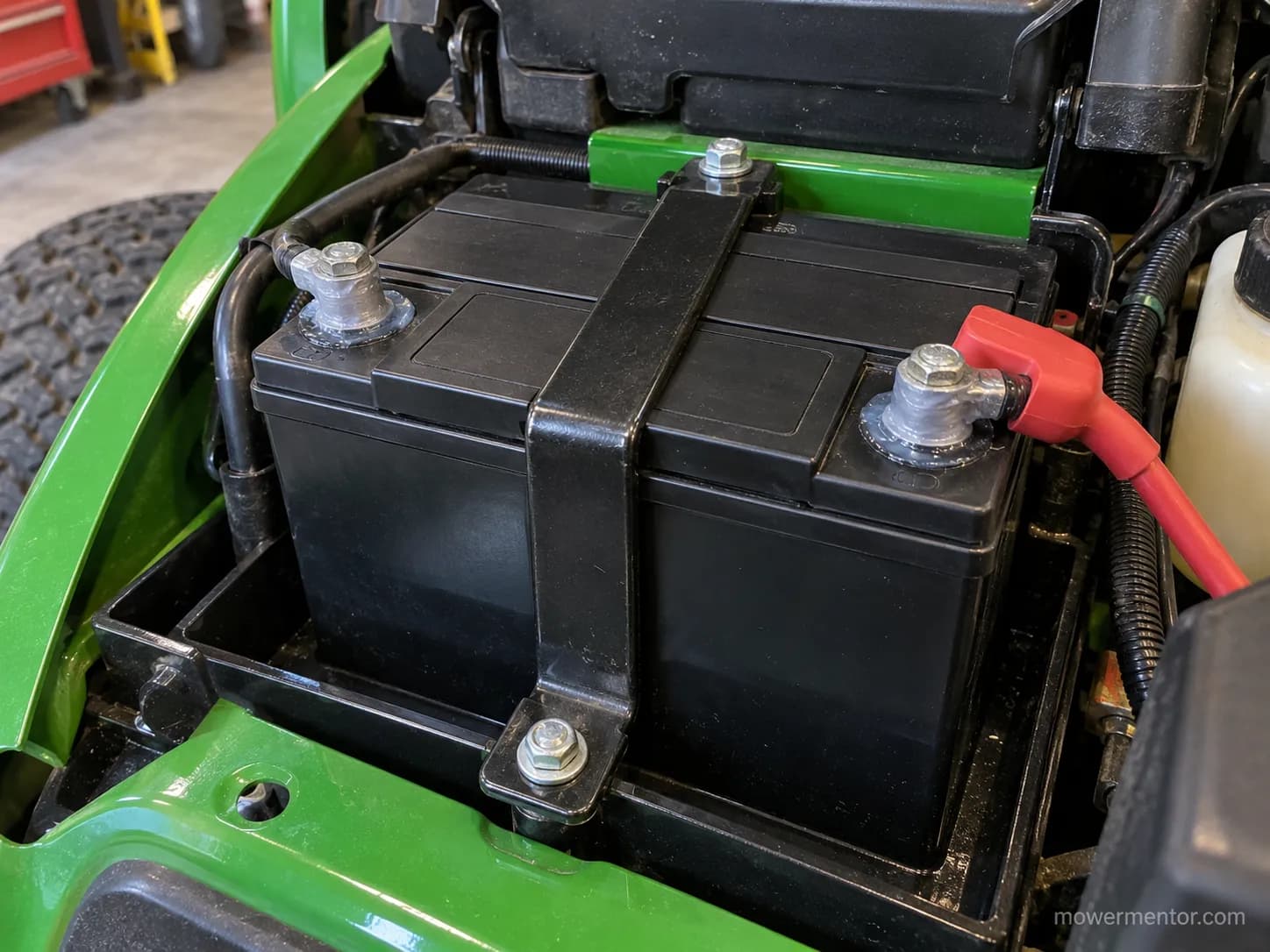 Cleaned tray and greased terminals on a new John Deere mower battery