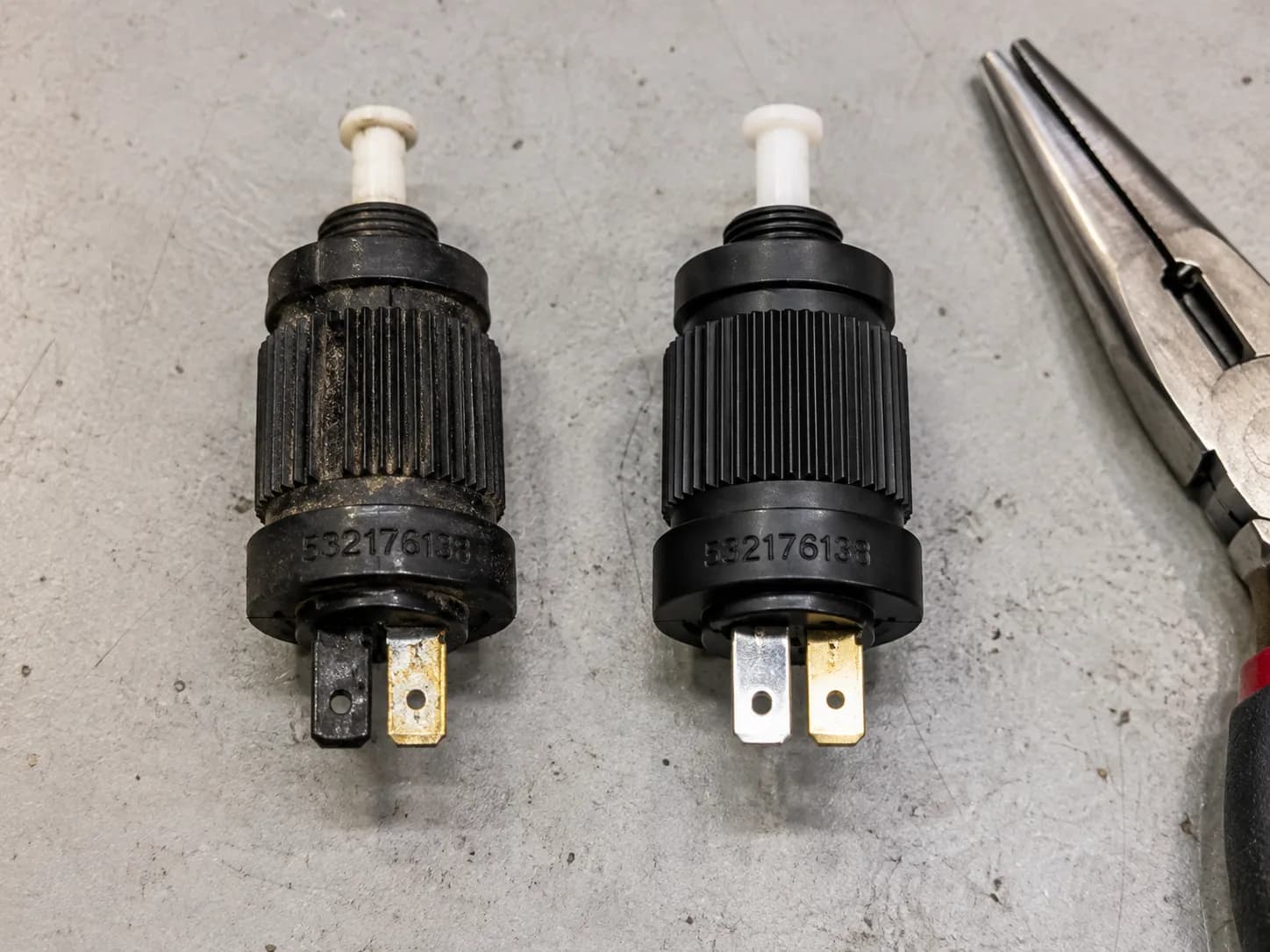 Husqvarna interlock safety switch part number 532176138 old versus new.