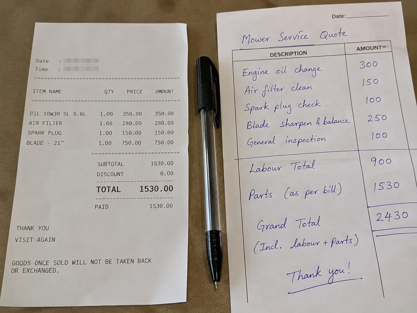 Top-down view of a mower parts receipt beside a handwritten service quote slip with a pen placed between them on a desk, showing a parts cost and labor estimate comparison.
