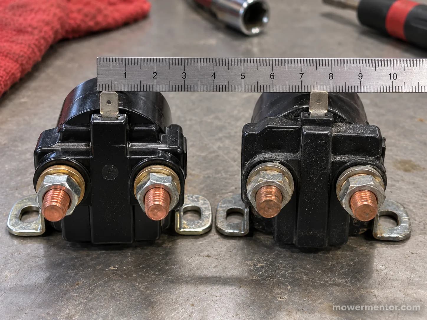 OEM Cub Cadet 925-1426A starter solenoid next to an aftermarket equivalent for fitment comparison.