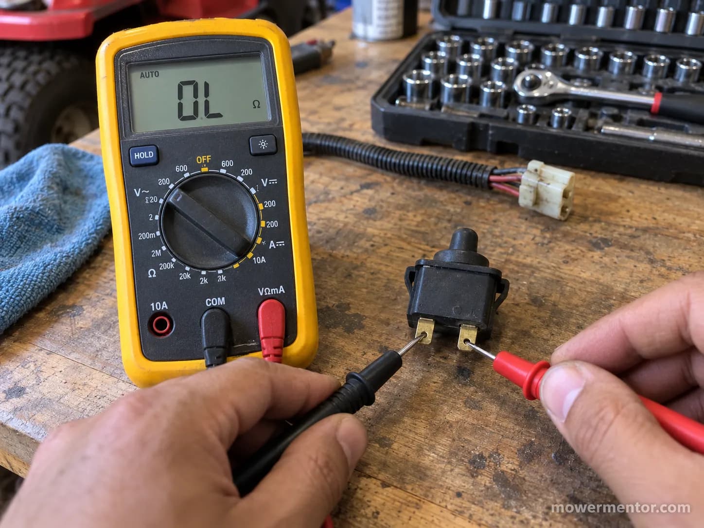 Multimeter showing no continuity on a lawn mower seat safety switch