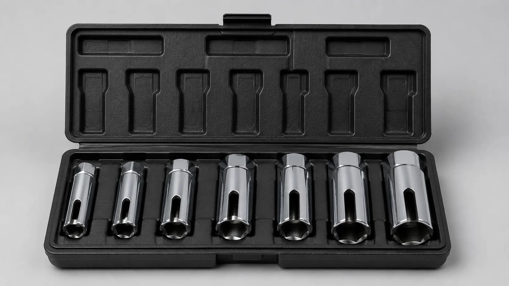 Open spark plug socket set in a molded tool case with seven chrome sockets, including a thin-wall spark plug socket for recessed lawn mower and small engine spark plug wells.
