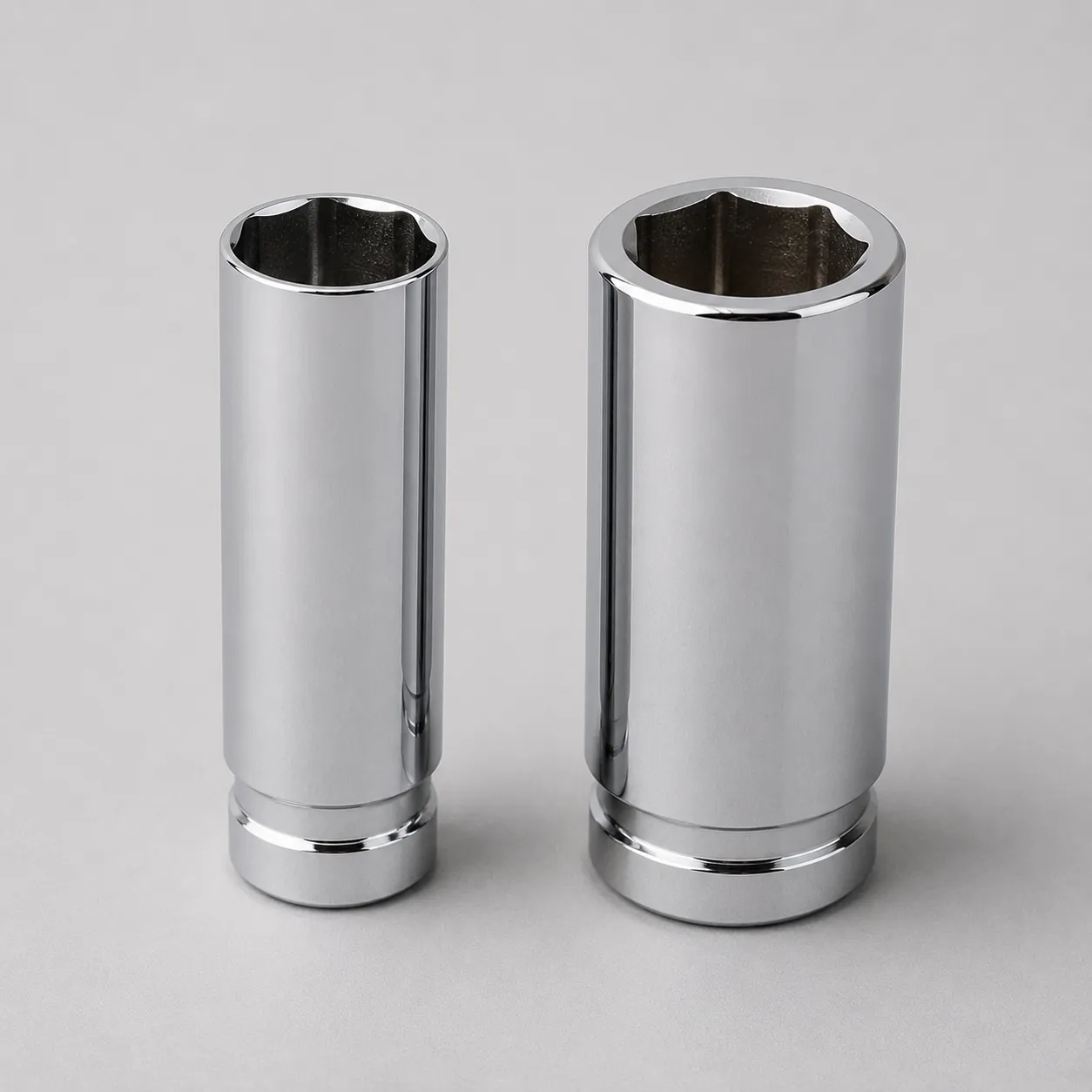 Thin-wall and standard spark plug sockets of the same size shown side by side, highlighting the thinner wall design for accessing recessed lawn mower spark plug wells.
