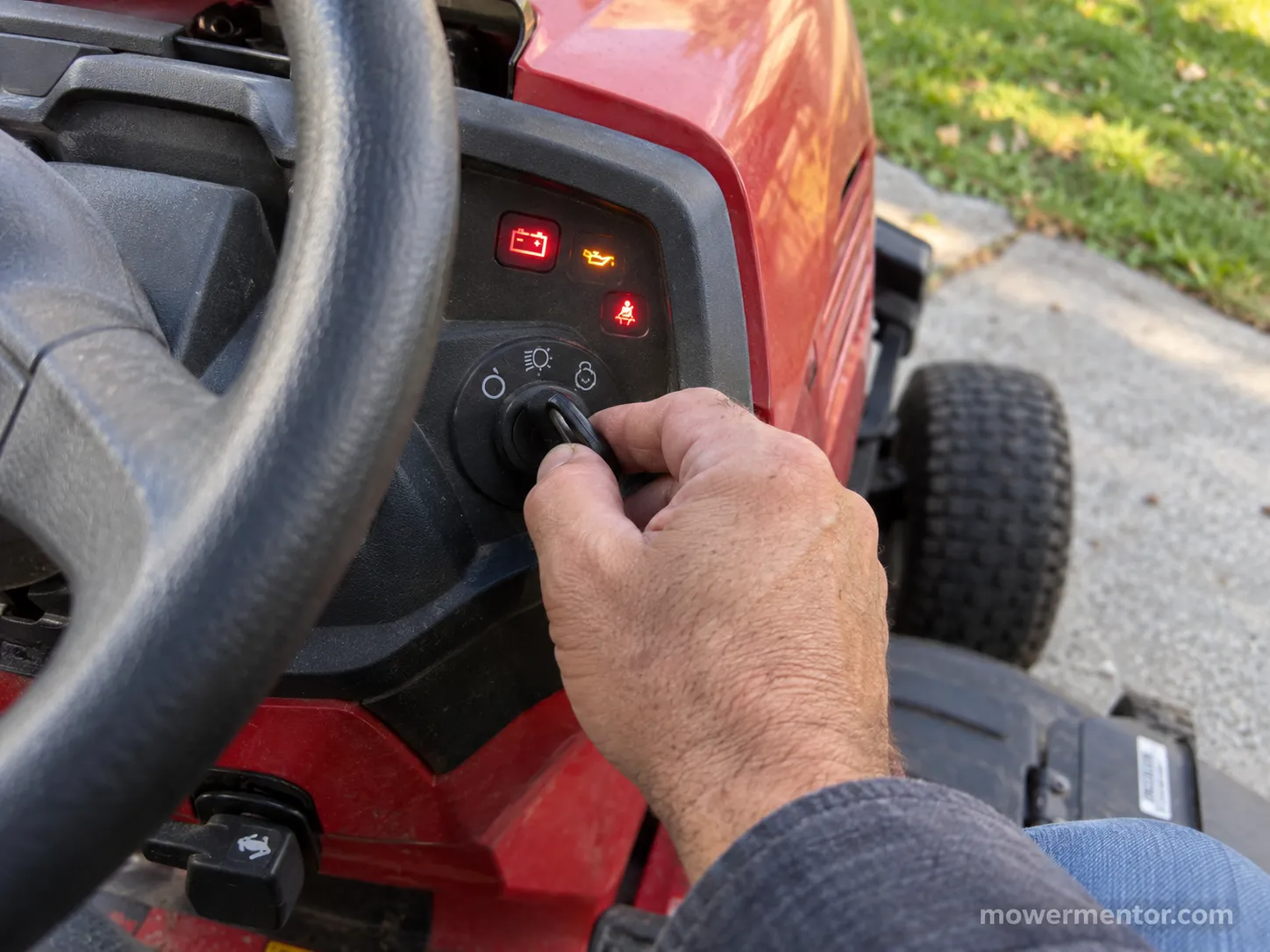 Turning the key on a Troy-Bilt riding mower that won't start and just clicks.